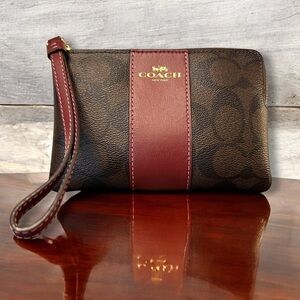 Coach Burgundy and Brown Corner Zip Wristlet in Signature Canvas, EUC